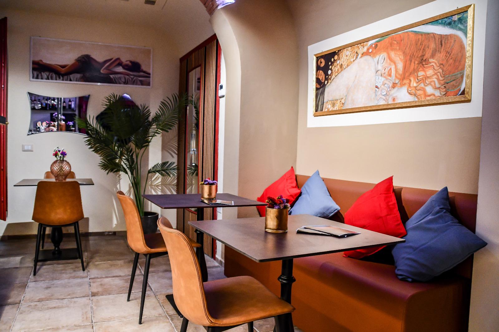 Inside SCENTO — tropical plants, gilded artwork and warm leather seating