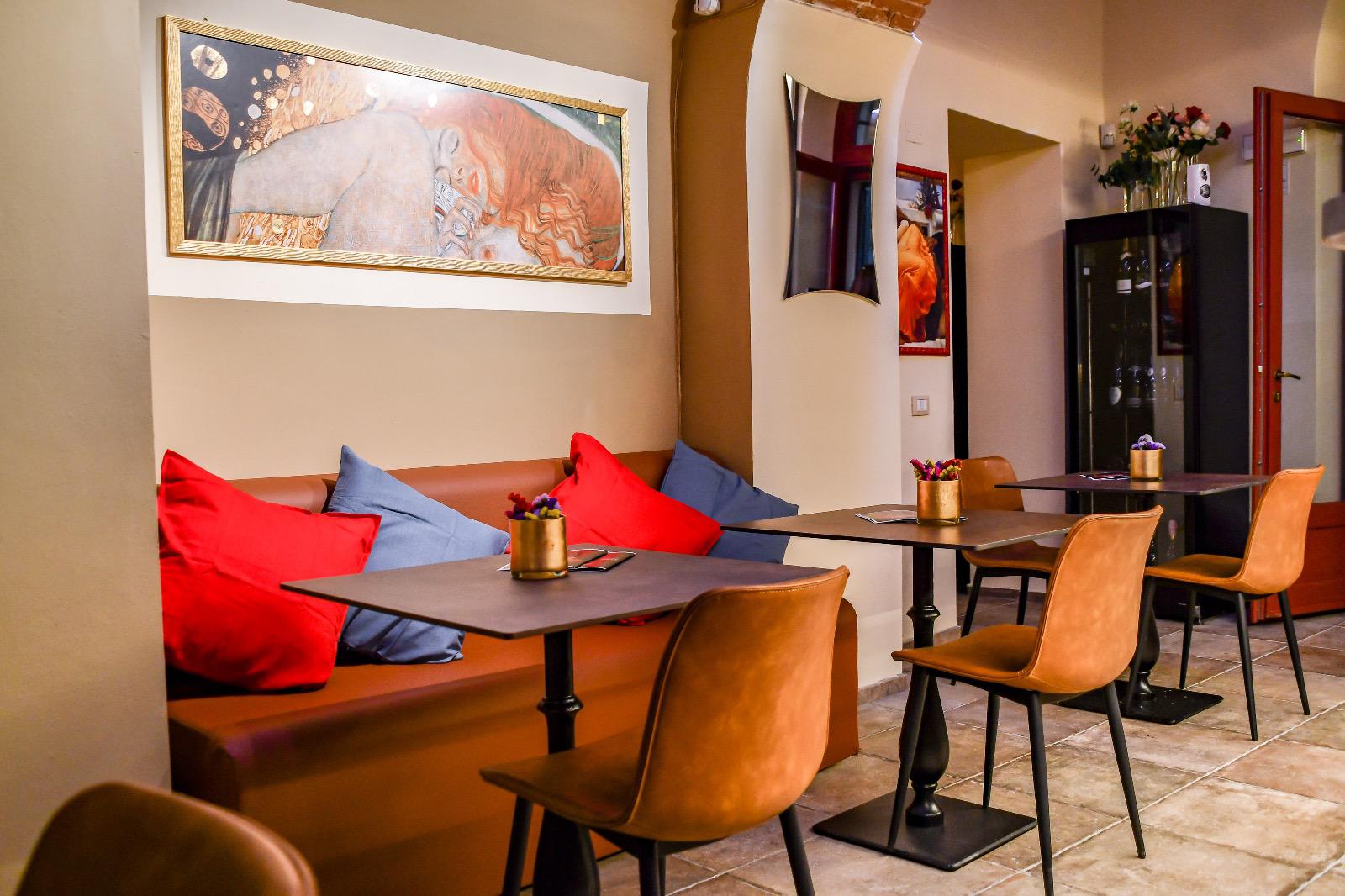 Velvet cushions, gilded art and warm leather seating at SCENTO