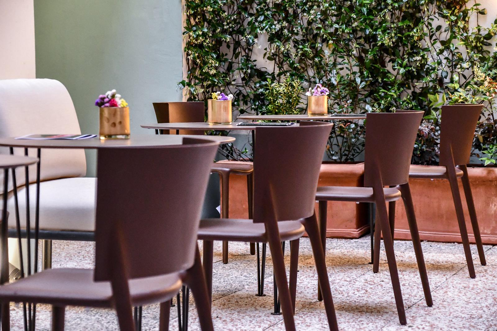 Outdoor seating among lush greenery
